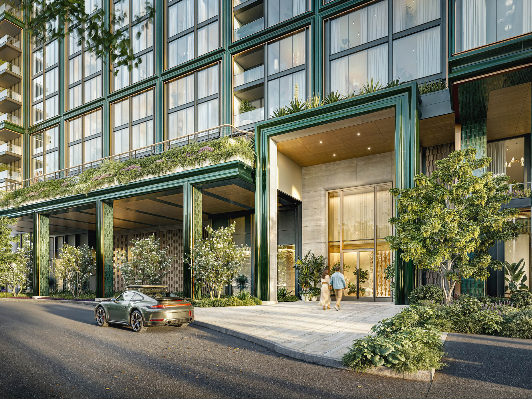Street-level rendering of the One Lady Bird Lake entrance, with a canopied doorway, green-tiled façade, planted terraces and a car waiting in the private motor court