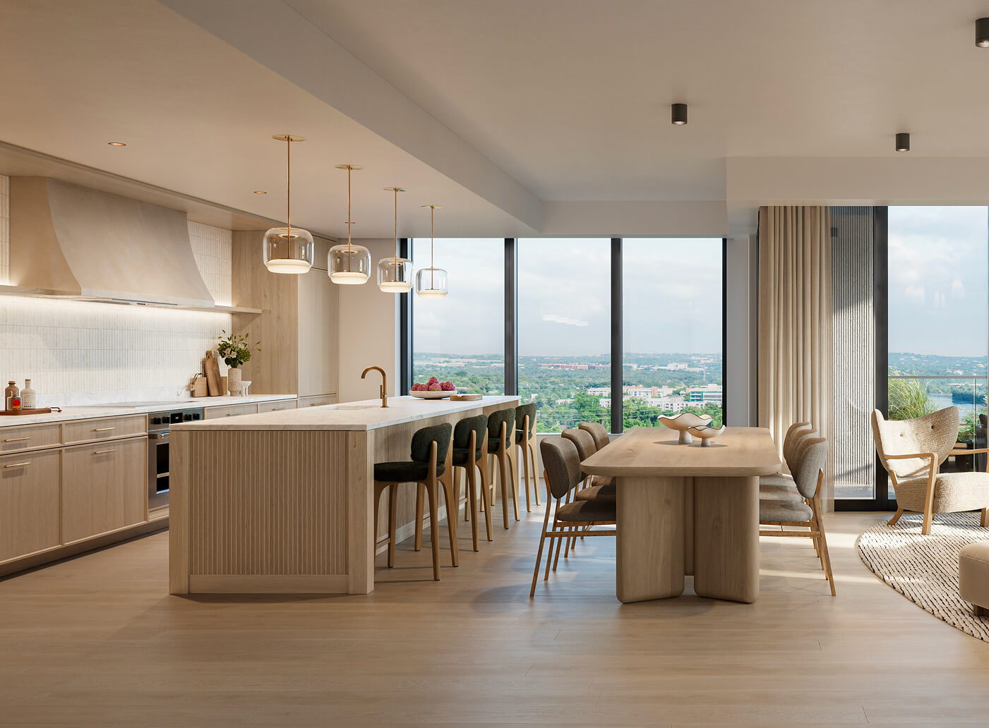 Kitchen with a long pale oak island, dark leather bar stools and glass pendant lights, an oak dining table beside it and floor-to-ceiling windows looking out over trees and the city.
